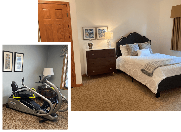 A bedroom with a large bed featuring a dark upholstered headboard, white bedding, and pillows. Next to the bed is a dark wooden nightstand with a lamp and decorative framed artwork above. In the corner, a window with beige curtains. An inset shows a separate room with a treadmill and a lamp on a side table, with framed artwork on the wall.